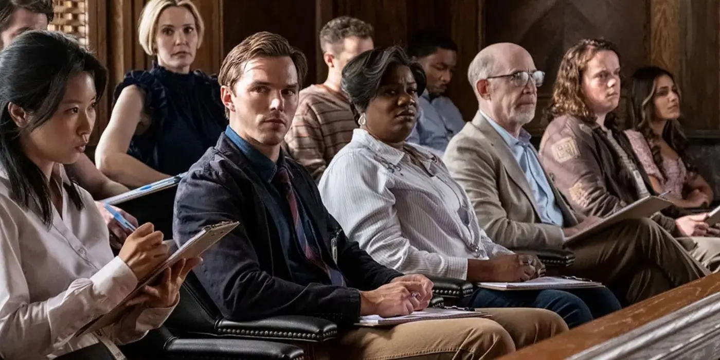 A group of jurors listen to courtroom testimony.