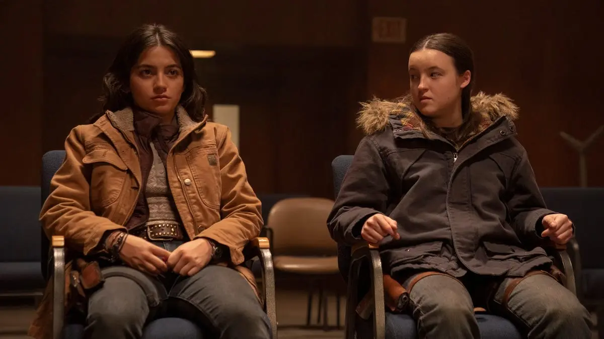 Ellie and a new character, Dina, sit together in Jackson.