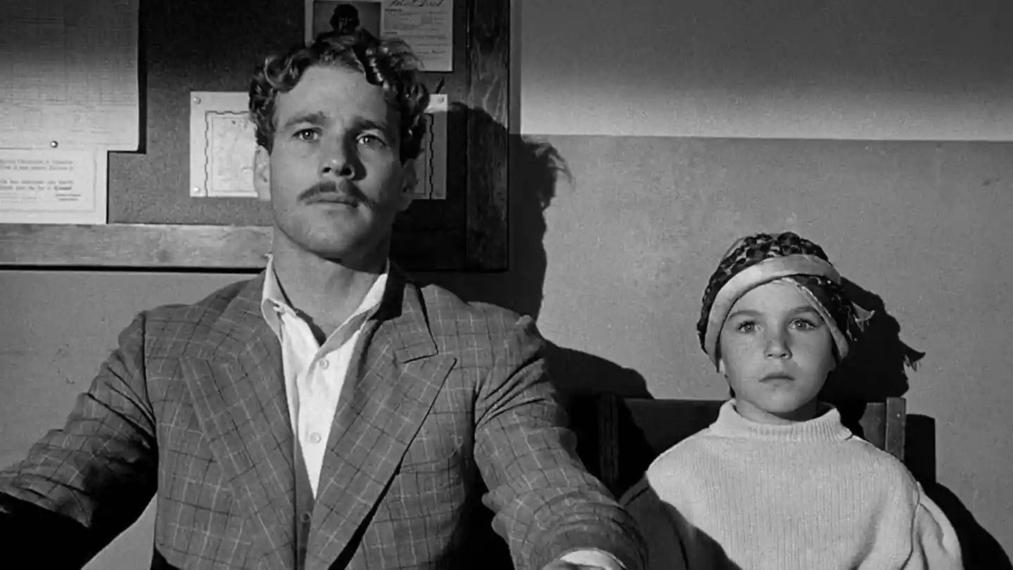 A con man and a young girl team up in this charming Depression-era tale.