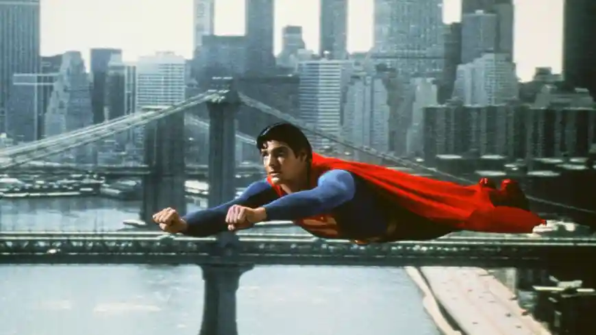 Superman flies through Metropolis.