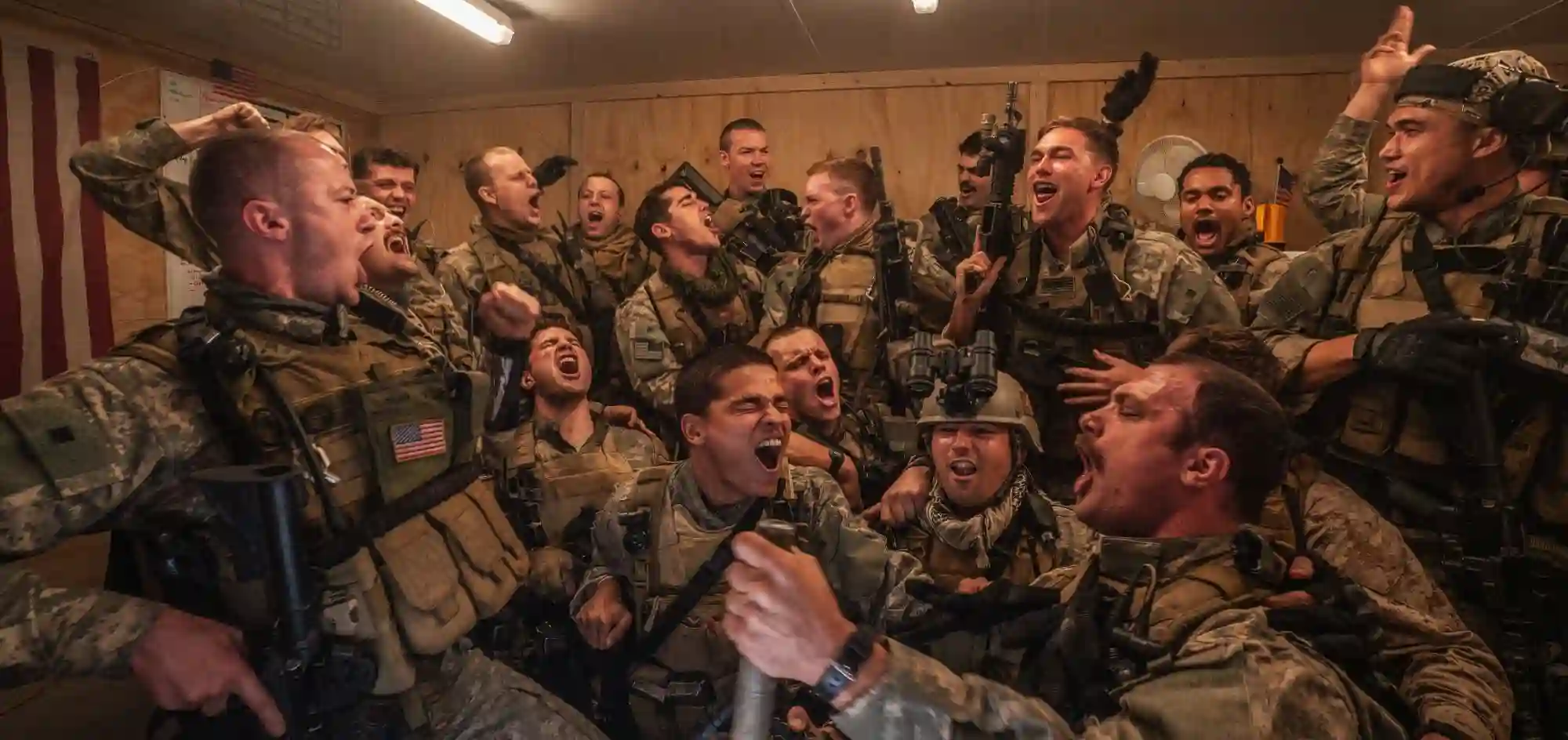 A team of Navy Seals enjoy a moment of brotherhood, before the chaos of battle.